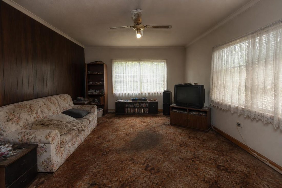 A dated living room photographed on a phone