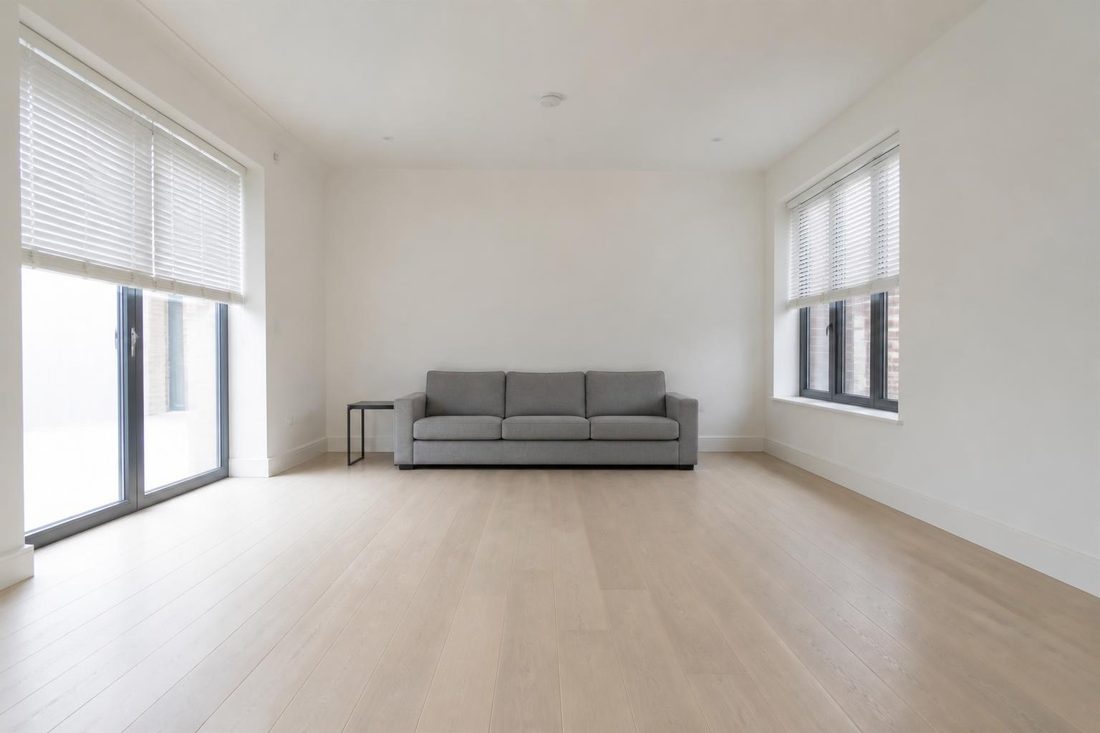 An empty, unfurnished living room before redesign